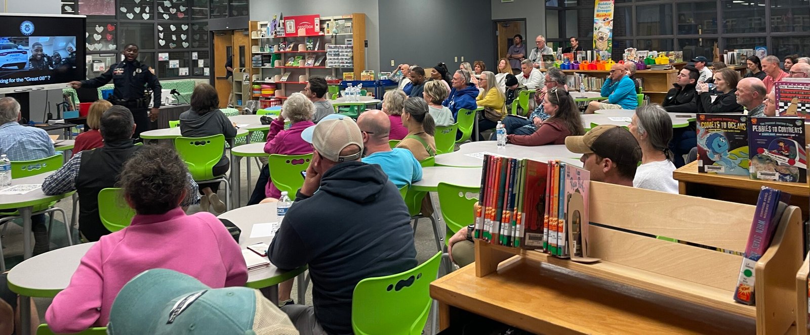 Panorama view of White Station Elementary School library filled to capacity on March 21, 2024, with more than 50 people for the inaugural meeting of the Avon Woods Neighborhood Watch