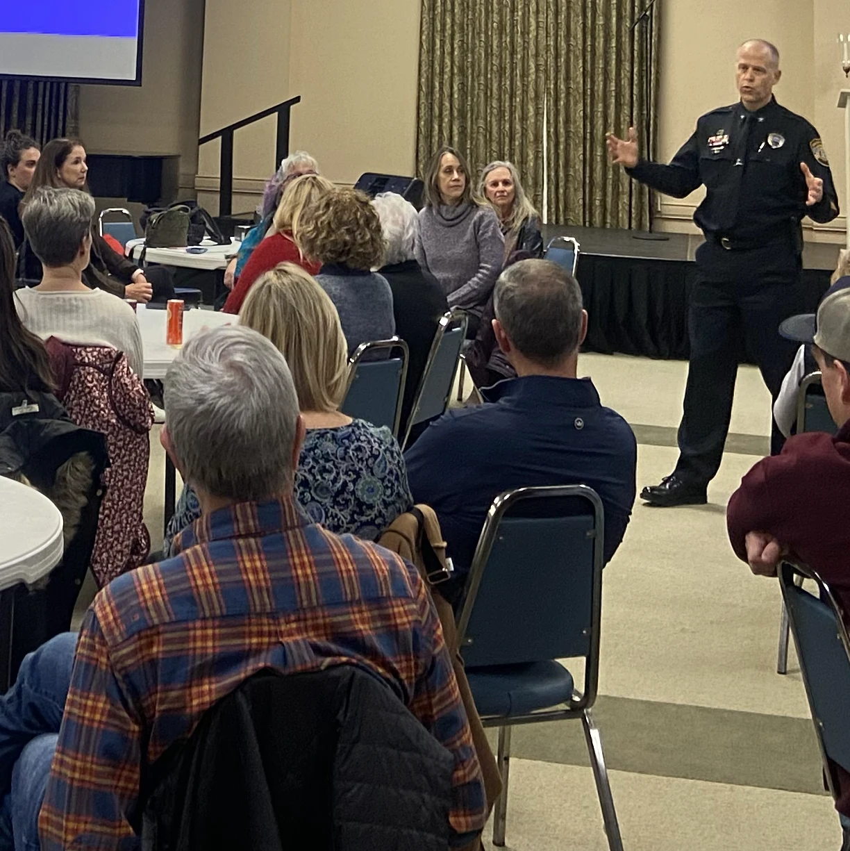 Colonel Christ Moffatt, chief commander of the MPD Appling Farms Station, addresses the group